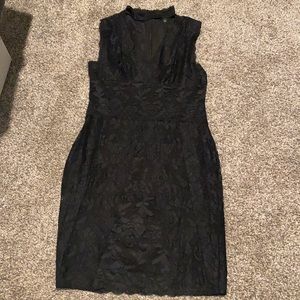 Black V neck with collar around neck. Lace.